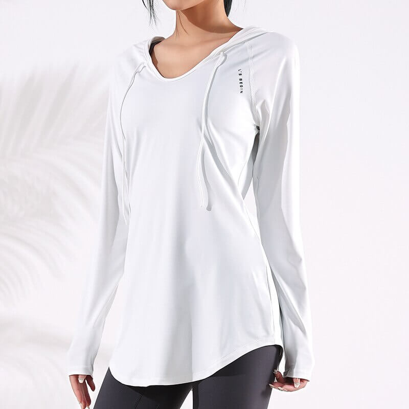 Woman wearing a white sports loose hooded sweatshirt, perfect for yoga or fitness with high-quality, breathable fabric.